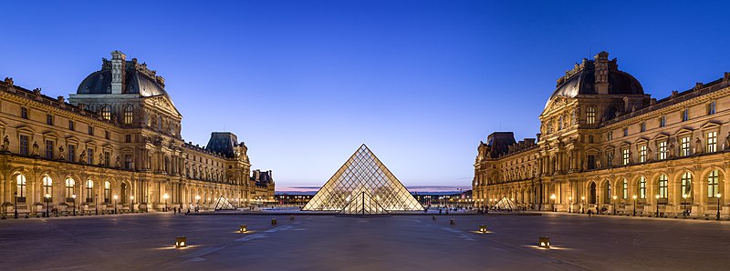 Louvre Museum's Napoleon Courtyard, at dusk.